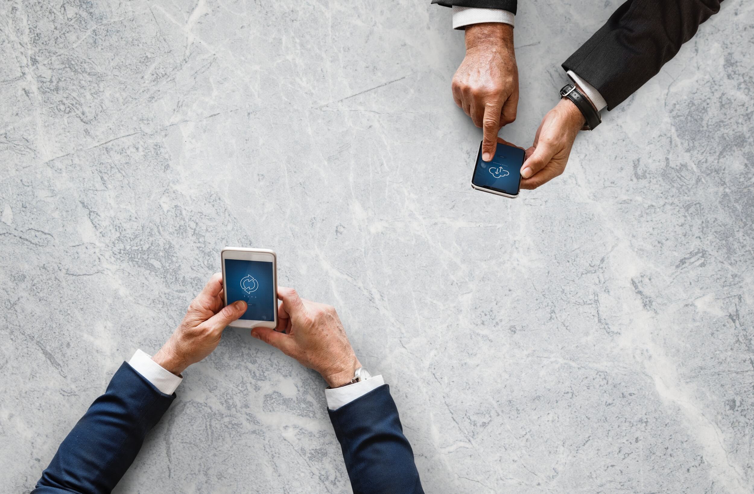 Two individuals holding cell phones depicting the different types of inbound & outbound calls