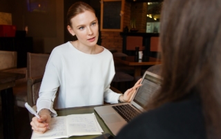 manage outsourced employees woman at cafe