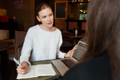 manage outsourced employees woman at cafe