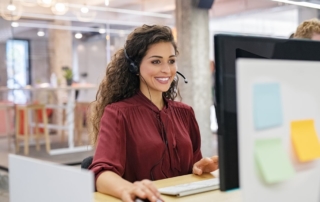 Smiling woman using multi channel customer service