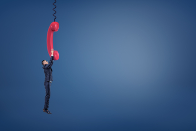 man hanging from phone