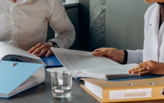 people sitting at a table discussing the insurance bpo guide