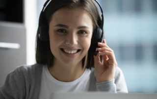a person wearing a headset researching inbound call center solutions