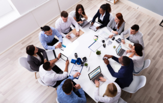 a bpo outsourcing team hard at work in a conference room