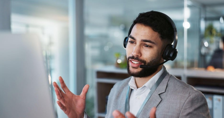 A contact center agent makes an outbound call to a promising lead.