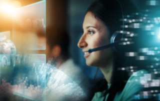 A call center agent uses speech analytics through a futuristic heads up display to aid in answering a customer’s question.