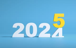 An illustration of the number 2024 rolling over into the number 2025, symbolizing the coming of the new year.