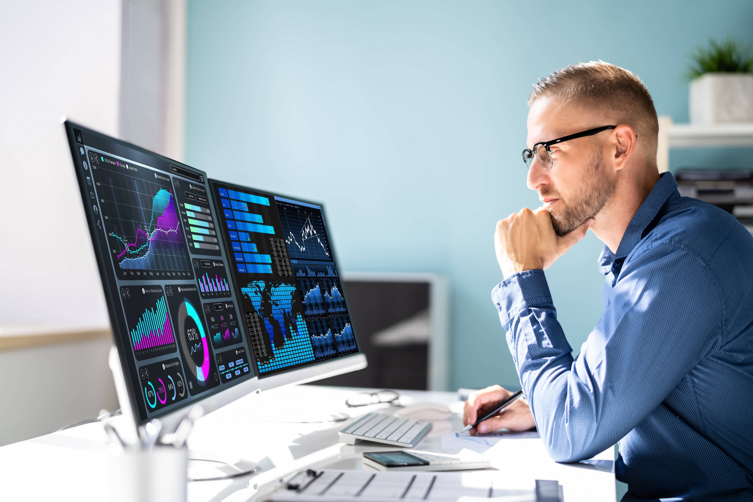 Man sitting at computer managing data