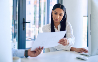 Call center agent reviewing a call script.