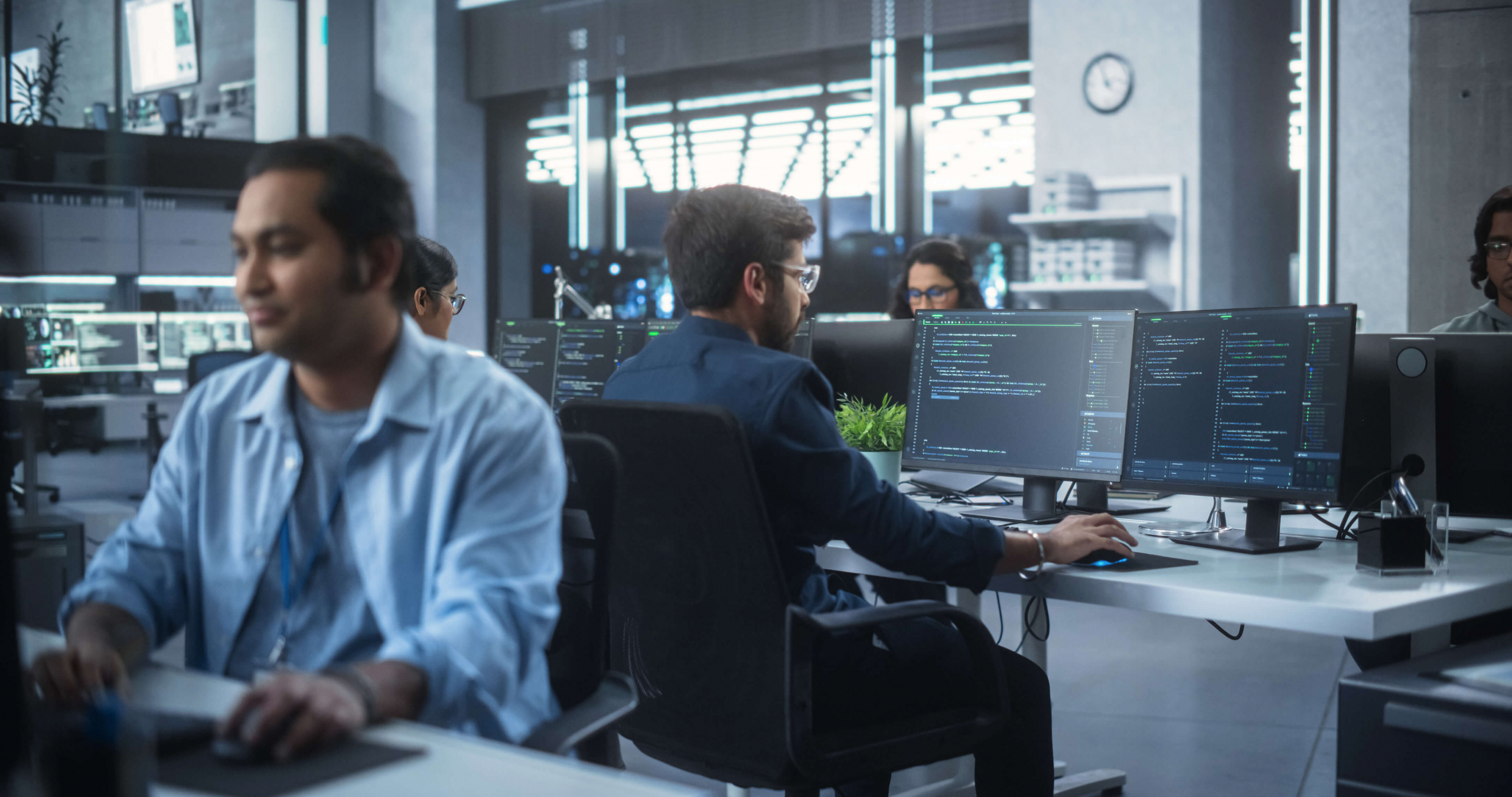 Group of tech support workers on their computers