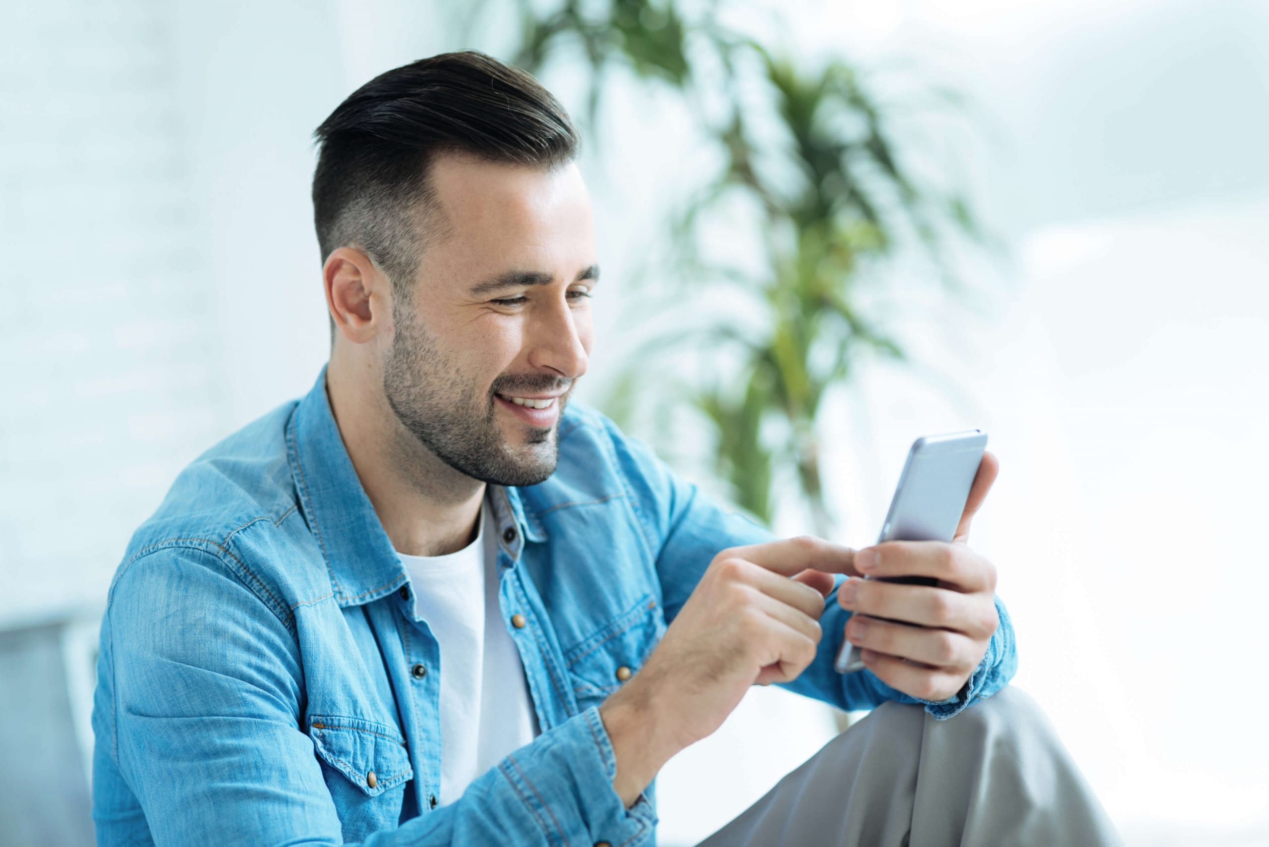 Young bearded man on his cell phone