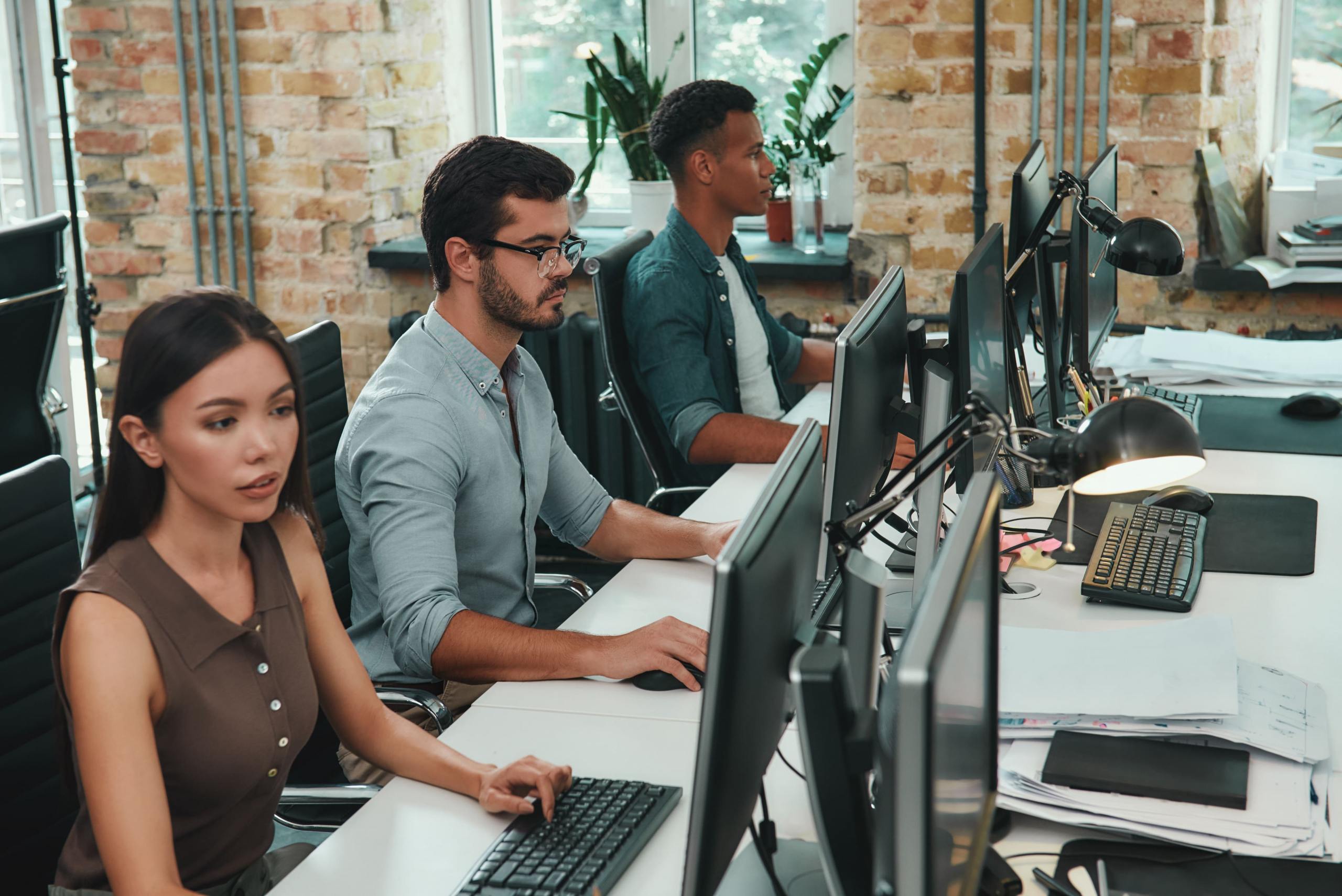 Group of co-workers working on their computers