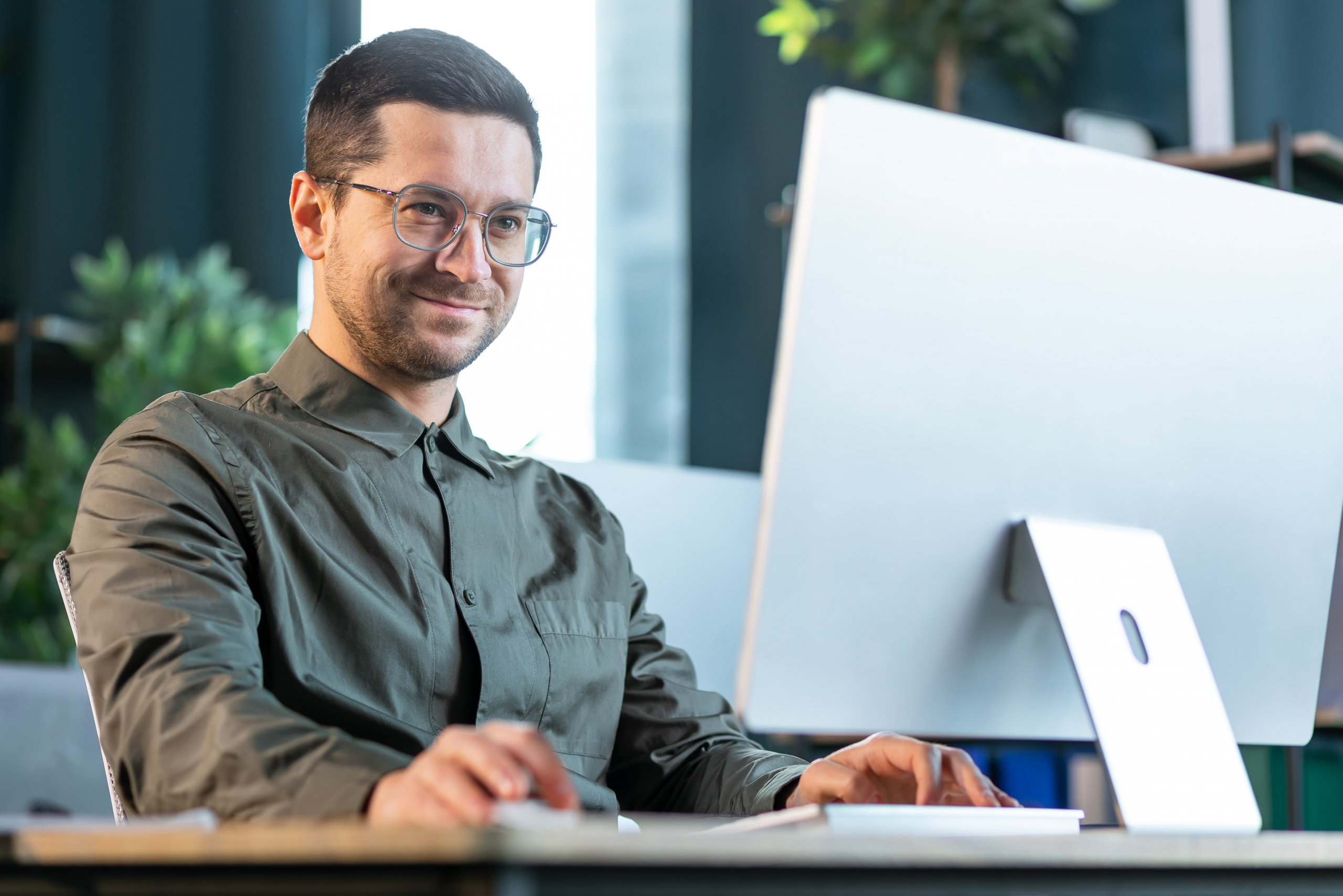 middle aged male working on his computer