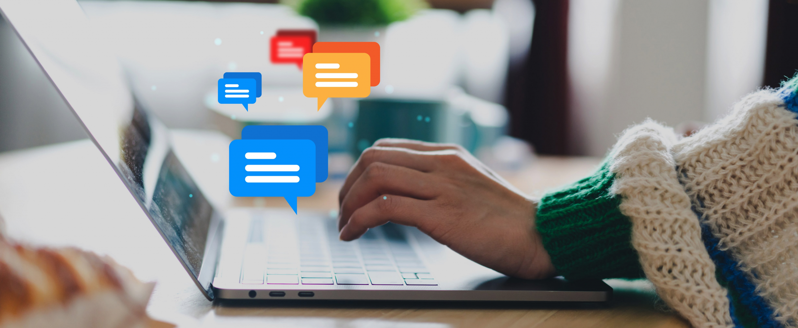 An image of a person typing on a laptop with overlay icons of chat bubbles.