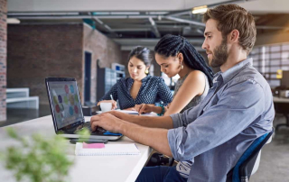 group of smartshore co-workers working in an office