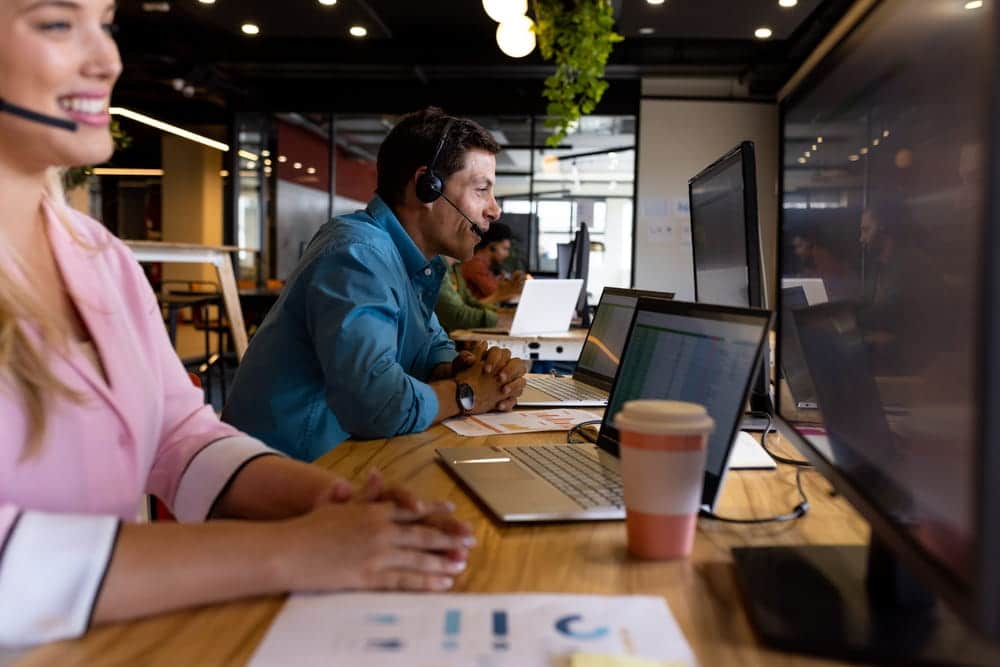 contact center workers working with human in the loop ai technology